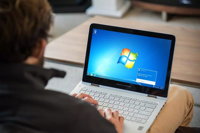 person using a Windows laptop